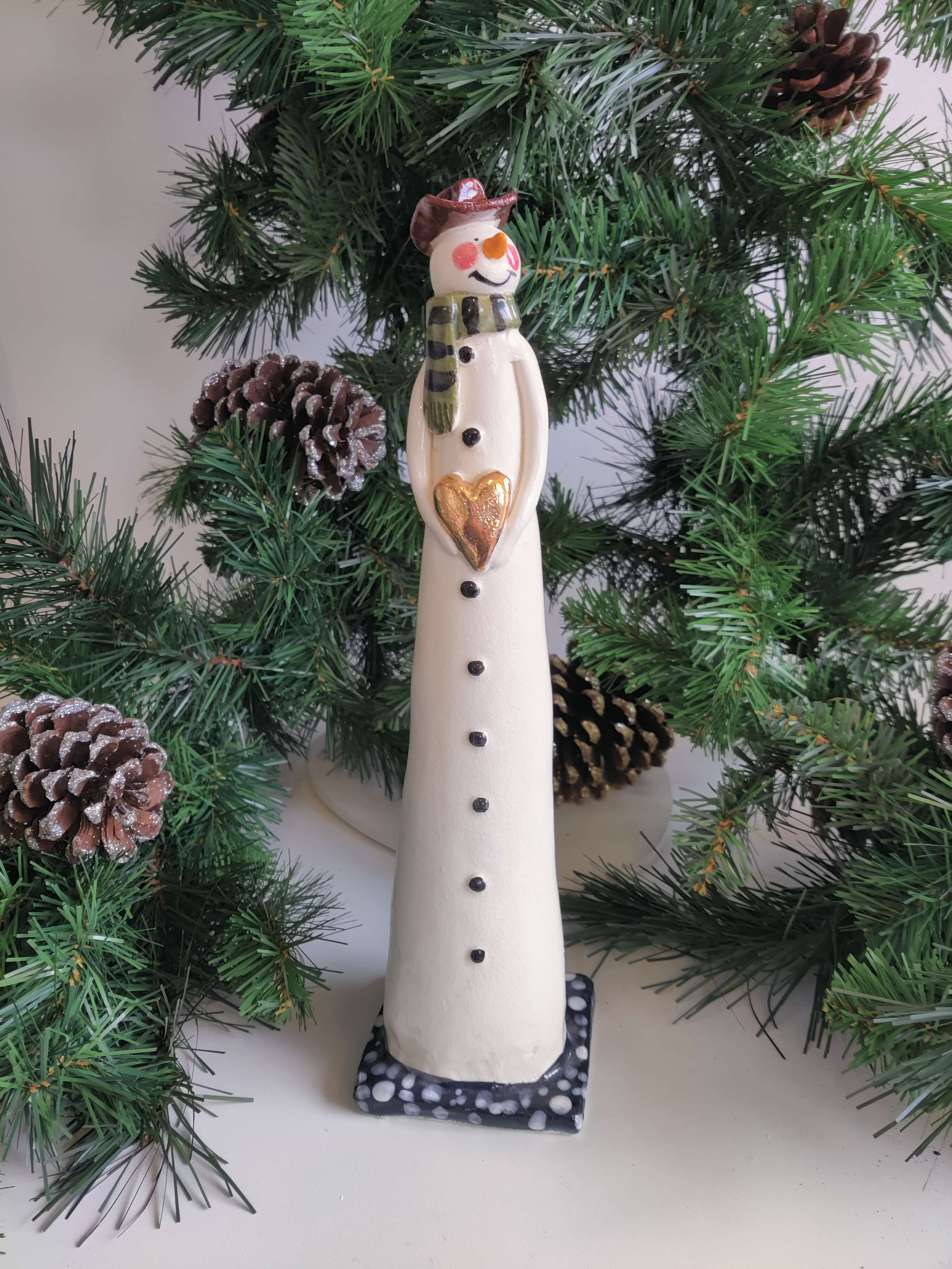 Joanne Robey, Snowman Green Stripe Scarf holding a Gold Heart *For Click and Collect only*