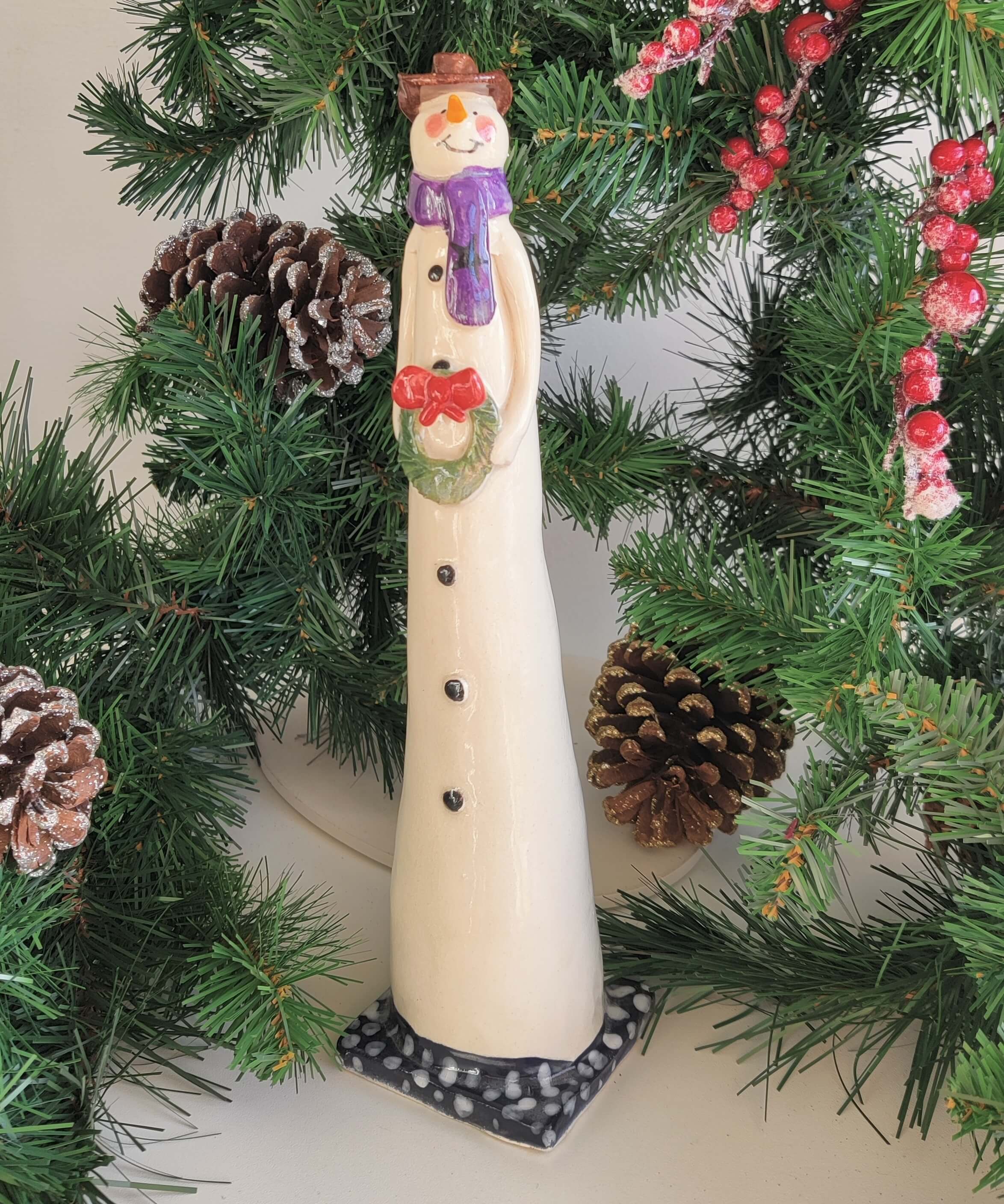Joanne Robey, Snowman Purple Star Scarf holding a Wreath